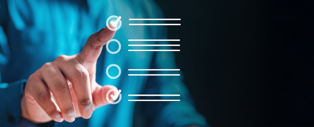 Hand touching a digital checklist with checkmarks and lines on a dark background.